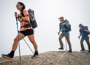 Three people hiking using Black Diamond walking poles
